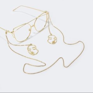 Abstract Golden Colored Human Faces Glasses Chain